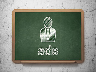 Image showing Advertising concept: Business Man and Ads on chalkboard background