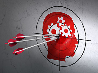 Image showing Business concept: arrows in Head With Gears target on wall