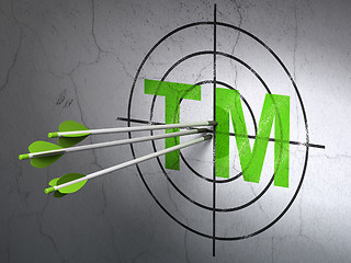 Image showing Law concept: arrows in Trademark target on wall background