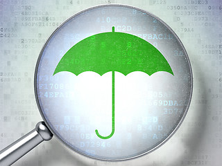 Image showing Security concept: Umbrella with optical glass on digital background