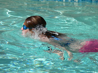 Image showing woman swimming in pool