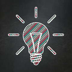 Image showing Finance concept: Light Bulb on chalkboard background