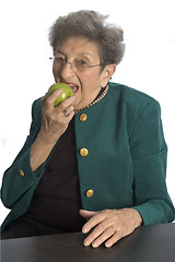 Image showing woman eating an apple