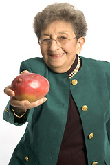 Image showing senior woman with mango