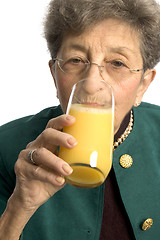 Image showing woman drinking orange juice