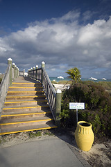 Image showing boardwalk with yellow urn