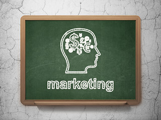 Image showing Advertising concept: Head With Finance Symbol and Marketing on chalkboard