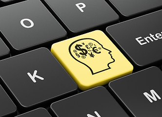 Image showing Advertising concept: Head With Finance Symbol on computer keyboard background