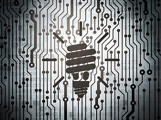 Image showing Finance concept: circuit board with Energy Saving Lamp