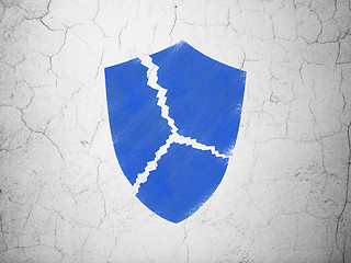 Image showing Protection concept: Broken Shield on wall background