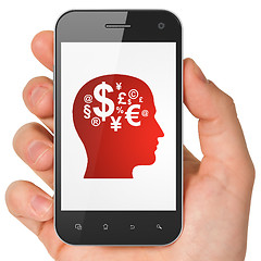 Image showing Advertising concept: Head With Finance Symbol on smartphone