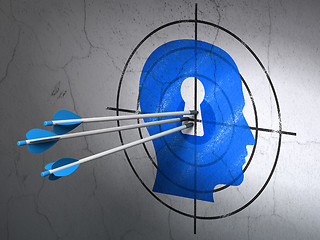 Image showing Marketing concept: arrows in Head With Keyhole target on wall background