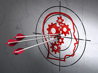 Image showing Advertising concept: arrows in Head With Gears target on wall background