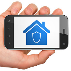 Image showing Finance concept: Home on smartphone