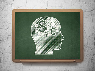 Image showing Education concept: Head With Finance Symbol on chalkboard background