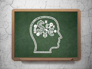 Image showing Marketing concept: Head With Finance Symbol on chalkboard background