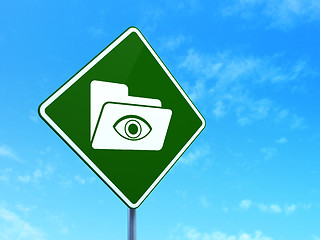 Image showing Finance concept: Folder With Eye on road sign background