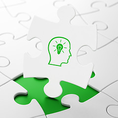 Image showing Education concept: Head With Lightbulb on puzzle background