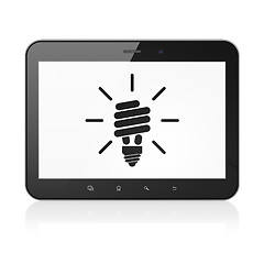 Image showing Finance concept: Energy Saving Lamp on tablet pc computer