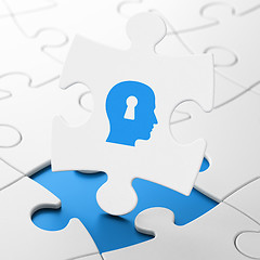 Image showing Marketing concept: Head With Keyhole on puzzle background