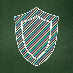 Image showing Privacy concept: Shield on chalkboard background