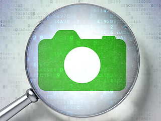 Image showing Vacation concept: Photo Camera with optical glass on digital background