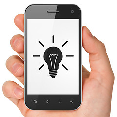 Image showing Finance concept: Light Bulb on smartphone