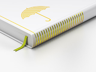 Image showing Protection concept: closed book, Umbrella on white background