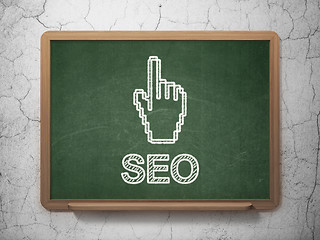 Image showing Web design concept: Mouse Cursor and SEO on chalkboard background