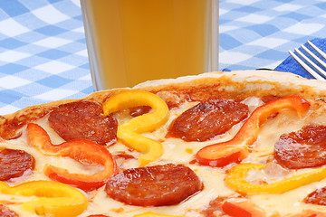 Image showing Hot spicy pizza and beer