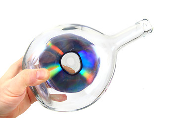 Image showing CD or DVD in the glass bottle 