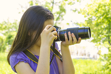 Image showing Teenage girl taking photos