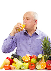 Image showing Mature man drinking juice 