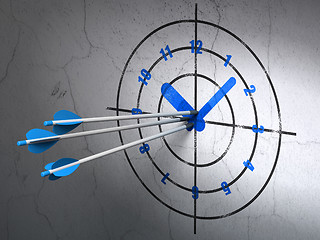 Image showing Timeline concept: arrows in Clock target on wall background