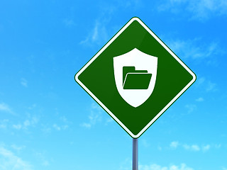 Image showing Business concept: Folder With Shield on road sign background