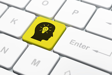 Image showing Finance concept: Head With Light Bulb on computer keyboard background