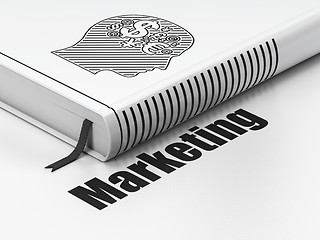 Image showing Advertising concept: book Head With Finance Symbol, Marketing on white background