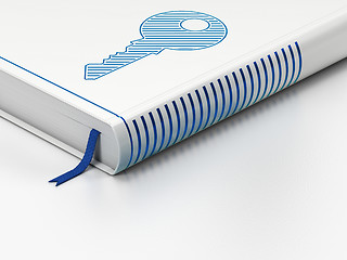 Image showing Protection concept: closed book, Key on white background