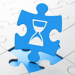 Image showing Time concept: Hourglass on puzzle background