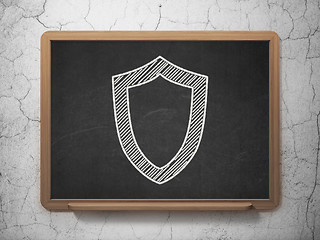 Image showing Protection concept: Contoured Shield on chalkboard background