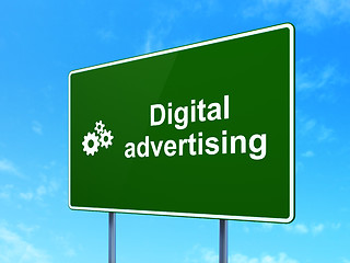 Image showing Advertising concept: Digital Advertising and Gears on road sign background