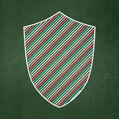 Image showing Privacy concept: Shield on chalkboard background