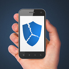 Image showing Security concept: Broken Shield on smartphone
