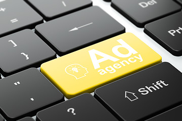Image showing Marketing concept: Head With Lightbulb and Ad Agency on keyboard