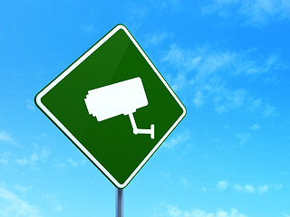 Image showing Protection concept: Cctv Camera on road sign background