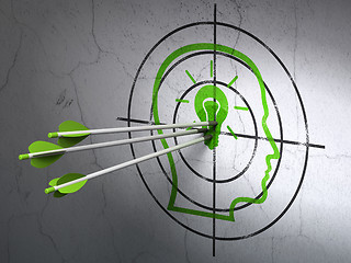 Image showing Education concept: arrows in Head With Lightbulb target on wall background
