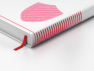 Image showing Protection concept: closed book, Shield on white background