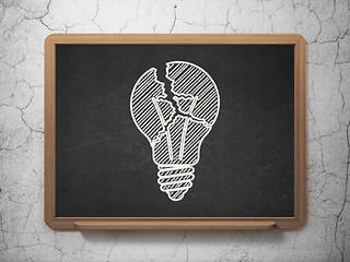 Image showing Finance concept: Light Bulb on chalkboard background