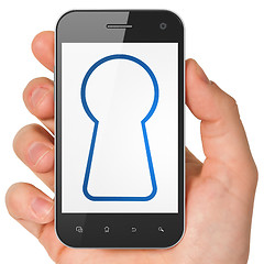 Image showing Security concept: Keyhole on smartphone