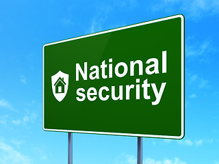 Image showing Security concept: National Security and Shield on road sign background